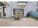 Backyard with a paved patio with table and chairs and a grill at 9443 Merrifield St, Orlando, FL 32827