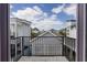 Balcony with a black metal safety rail and a view of other residences at 9443 Merrifield St, Orlando, FL 32827