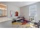 Bright bedroom with a hard floor, colorful rug and a small bed and decorative accents at 9443 Merrifield St, Orlando, FL 32827