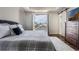 Bedroom with a king bed, balcony access, and an ensuite bathroom at 9443 Merrifield St, Orlando, FL 32827