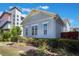 View of a house, highlighting its siding, symmetrically placed windows, and well-maintained outdoor space at 9443 Merrifield St, Orlando, FL 32827