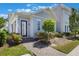 Beautiful home exterior with landscaped yard and walkway leading to an inviting front door with glass at 9443 Merrifield St, Orlando, FL 32827