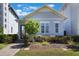 Inviting home featuring a well-kept lawn, garden, and a welcoming front entrance with a clear door at 9443 Merrifield St, Orlando, FL 32827