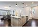 Open kitchen layout flows into other areas of the house, complete with high-end appliances and finishes at 9443 Merrifield St, Orlando, FL 32827