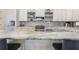 Close-up of kitchen island featuring a granite countertop, stainless steel sink, and modern faucet at 9443 Merrifield St, Orlando, FL 32827
