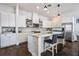 This kitchen features an island, stainless steel appliances, and modern finishes at 9443 Merrifield St, Orlando, FL 32827