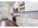 Stylish kitchen with granite countertops, stainless steel appliances, and ample cabinet space for storage at 9443 Merrifield St, Orlando, FL 32827