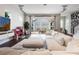 Living space features hardwood floors, white sofa, and sliding doors providing access to the outdoor area at 9443 Merrifield St, Orlando, FL 32827