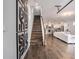 Spacious living area showcasing hardwood floors, modern decor, and an open layout to the kitchen at 9443 Merrifield St, Orlando, FL 32827