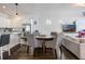 Dining and living areas in an open-concept design, offering a seamless flow for entertaining at 9443 Merrifield St, Orlando, FL 32827