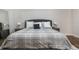 Main bedroom with a plush bed, nice end tables, and attractive accents throughout at 9443 Merrifield St, Orlando, FL 32827
