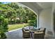 Covered backyard patio with comfortable seating, perfect for outdoor relaxation and entertaining at 9743 Covent Garden Dr, Orlando, FL 32827