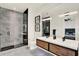Contemporary bathroom features a glass-enclosed shower, double vanity, and stylish fixtures at 9743 Covent Garden Dr, Orlando, FL 32827
