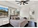 Charming bedroom featuring a stylish bed, lush hanging greenery, and ample natural light at 9743 Covent Garden Dr, Orlando, FL 32827