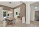 Open dining room with elegant lighting, adjacent to the kitchen, perfect for entertaining at 9743 Covent Garden Dr, Orlando, FL 32827