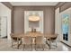 Dining room with stylish lighting, a modern table, and access to the outdoors at 9743 Covent Garden Dr, Orlando, FL 32827