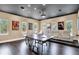 Entertainment room featuring a ping pong table, comfortable seating, and recessed lighting at 9743 Covent Garden Dr, Orlando, FL 32827