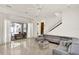 Open living room with large sliding glass doors, gray sectional sofa, and bright natural light at 9743 Covent Garden Dr, Orlando, FL 32827