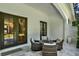 Covered patio featuring outdoor seating and direct access to the interior at 9743 Covent Garden Dr, Orlando, FL 32827