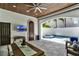 Covered patio area featuring tile floors, outdoor dining, a ceiling fan, and access to the pool at 9743 Covent Garden Dr, Orlando, FL 32827