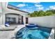 Inviting pool and spa area with integrated outdoor kitchen and lounge space for relaxation at 9743 Covent Garden Dr, Orlando, FL 32827