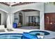 Inviting pool and spa area with integrated outdoor kitchen and lounge space for relaxation at 9743 Covent Garden Dr, Orlando, FL 32827