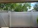 View of backyard fence with trees overhead on sunny day at 207 Esplanade Way # 101, Casselberry, FL 32707
