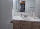 Bathroom with vanity and sink, mirror and lighting at 207 Esplanade Way # 101, Casselberry, FL 32707