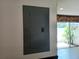 Image of electrical panel in hallway, with window and plant at end of hallway at 207 Esplanade Way # 101, Casselberry, FL 32707