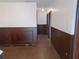 Inviting hallway featuring decorative wainscotting and neutral color palette throughout at 207 Esplanade Way # 101, Casselberry, FL 32707