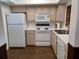 Functional kitchen features essential appliances and ample counter space at 207 Esplanade Way # 101, Casselberry, FL 32707