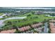 Beautiful aerial view showcasing a home's proximity to the golf course and residential area at 10533 Belfry Cir, Orlando, FL 32832