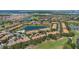 Captivating aerial shot of the community nestled amidst lush greenery and scenic water features at 10533 Belfry Cir, Orlando, FL 32832
