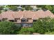 Overhead view of townhomes with screened patios and well-maintained tiled roofs at 10533 Belfry Cir, Orlando, FL 32832