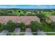 Aerial view of well-maintained townhomes with lush trees and landscaped surroundings at 10533 Belfry Cir, Orlando, FL 32832