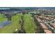 Expansive aerial perspective of the community highlighting the golf course and surrounding residences at 10533 Belfry Cir, Orlando, FL 32832