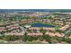 Elevated view of the community showcasing its beautiful golf course and surrounding landscape at 10533 Belfry Cir, Orlando, FL 32832