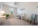 Well-lit bedroom with plush carpeting, ceiling fan, and a sunny window with blinds at 10533 Belfry Cir, Orlando, FL 32832