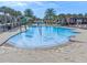 A fun community pool with colorful water features and palm trees, perfect for Gathering enjoyment and recreation at 10533 Belfry Cir, Orlando, FL 32832