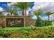 Eagle Creek community entrance sign surrounded by vibrant flowers and lush landscaping at 10533 Belfry Cir, Orlando, FL 32832