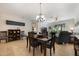 Bright dining area, seamlessly connecting to a living area with an open-concept design and stylish furnishings at 10533 Belfry Cir, Orlando, FL 32832