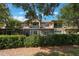 Townhome features screened lanais, balconies, stone accents, and manicured landscaping at 10533 Belfry Cir, Orlando, FL 32832