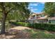 Charming townhome features stone accents, a screened lanai, and lush landscaping at 10533 Belfry Cir, Orlando, FL 32832