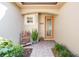 Warm and inviting front entrance with a decorative glass door and well-maintained landscaping at 10533 Belfry Cir, Orlando, FL 32832