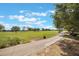 Picturesque golf course featuring a smooth cart path and manicured green lawns at 10533 Belfry Cir, Orlando, FL 32832