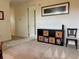 Hallway boasts neutral carpet, modern art, and storage with baskets for an organized look at 10533 Belfry Cir, Orlando, FL 32832
