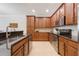 Well-equipped kitchen featuring stainless steel appliances, sleek dark countertops, and ample cabinet space at 10533 Belfry Cir, Orlando, FL 32832
