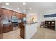 Charming kitchen featuring stainless steel appliances, granite countertops, and stylish wood cabinetry at 10533 Belfry Cir, Orlando, FL 32832