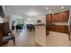 Spacious living area featuring open floor plan, tile floors, and seamless access to dining and living areas at 10533 Belfry Cir, Orlando, FL 32832