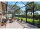 Relaxing screened-in patio with comfortable seating, open view, and access to the manicured lawn, ideal for outdoor enjoyment at 10533 Belfry Cir, Orlando, FL 32832